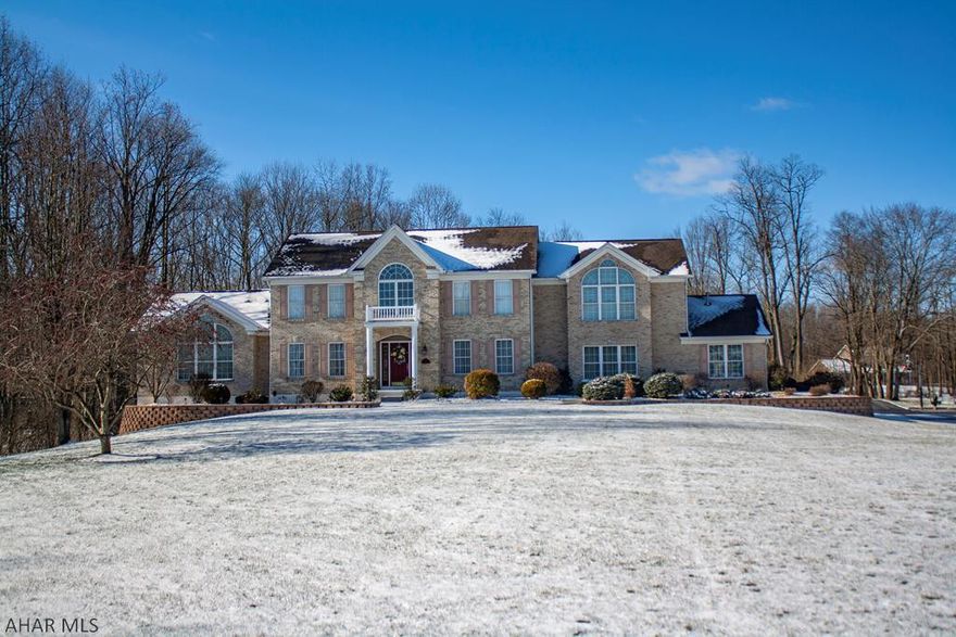 This absolutely stunning home is situated on 2.3 acres of land. This home features a luxurious master suite, a spacious bonus suite, and two standard bedrooms; the house also includes 5 bathrooms within, and 1 additional half bath in the pool house. On the main floor this home has a vaulted ceiling family room, an open concept eat-in kitchen, a beautiful formal dining room with a built-in dry bar and a home office. The home offers endless possibilities including the backyard of your dreams. This home is great for entertaining or relaxing with your family: featuring an in-ground pool, calming fish pond, patio fire pit, hot tub, and plenty of additional space for any other activities you may want to enjoy.