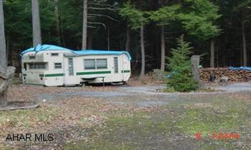 OLDER CAMPER OF LITTLE VALUE OLDER CAMPER OF LITTLE VALUE. NICE LEVEL CAMPSITE W/ STREAM