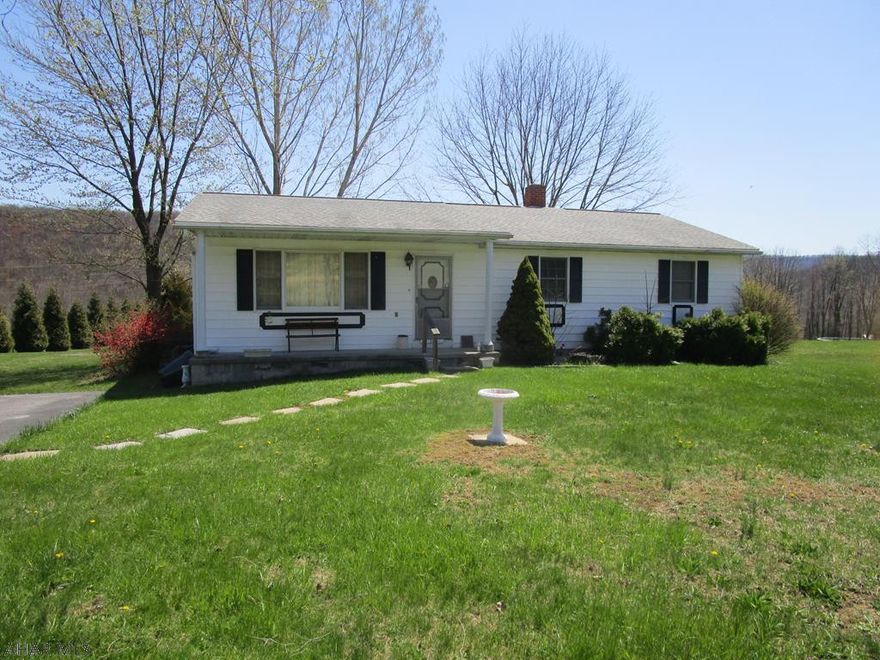 This ranch home rests on just over 1 acre with great views from the rear deck.  Home offers a living room, kitchen, dining room, 3-beds and 2-baths.  Full unfinished basement, electric BB heat, wood/coal stove, & 200-amp electric. Shingle roof and blacktop driveway were added within the last 10-years. Very nice location convenient to major roads and downtown Bedford. This could be a nice home with some work.
