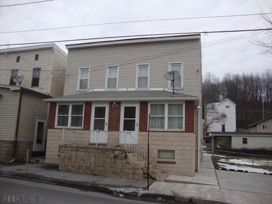 Investment opportunity that's hard to pass up!  Vinyl-sided duplex with 3 stall garage and 4 paved off street parking spaces. Each has enclosed front and rear porches with patio. Property for sale is 2312 and 2312 1/2 18th St.  Included is a separate deeded lot for 2308-2310 18th St which has the 3 car garage with openers.  Shelving and cabinets in garage included.  Both housing units have Lennox high efficiency furnaces with humidistats ,individual central air units, newer hot water heaters, separate 100 AMP circuit breakers and separate water and gas meters.  All newer thermopane windows. One side is handicap accessible with ramping to garage.  Additional storage building and large shed in back yard.  3 dusk-to-dawn lights.  Updated bathrooms.  Hardwood under carpeting.  Nice patio area.