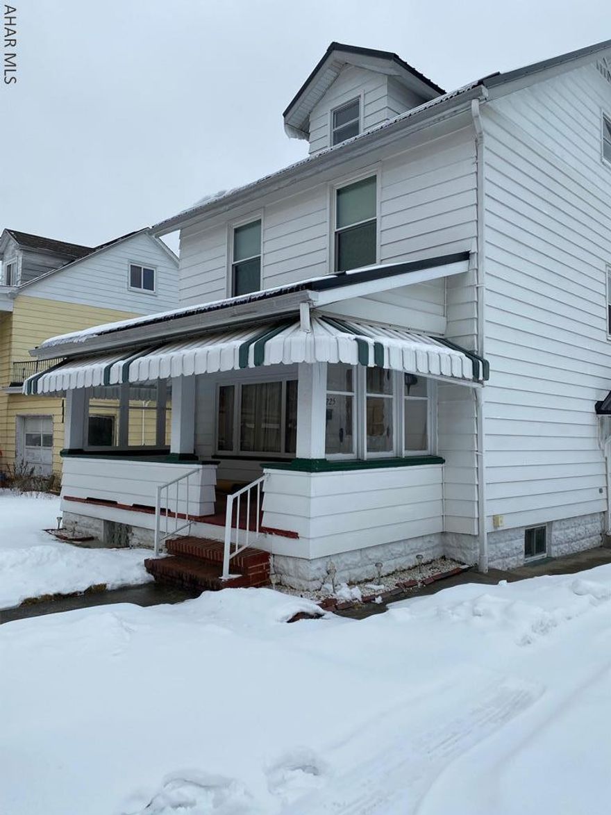 Nice, clean, vinyl sided starter home or investment property.  Updates include newer windows and new metal roof.  Good mechanics.  Off street parking.