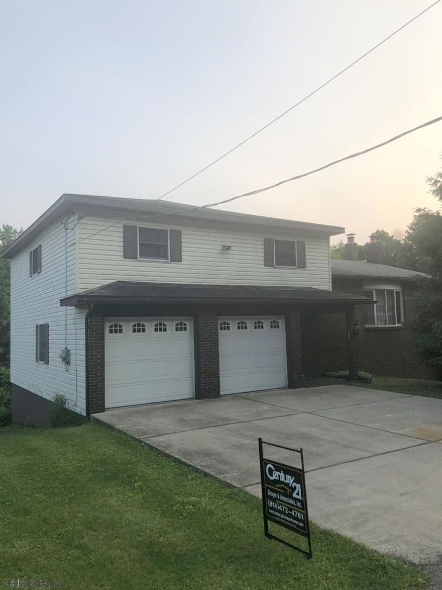 Jackson Twp - 4 BR bi-level home with room for 4 cars in the 2 garages on this 0.75 acre lot. Full finished basement. $129,900