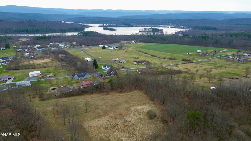 Beautiful building lot offering views of Shawnee Lake and the surrounding countryside. The 5.3+/- Acres offers open and wooded land, road frontage, and the availability to public sewer.  This property would make a great location to build your dream home or getaway with Shawnee State Park a short distance away, offering hiking & biking trails, camping, swimming, & fishing.