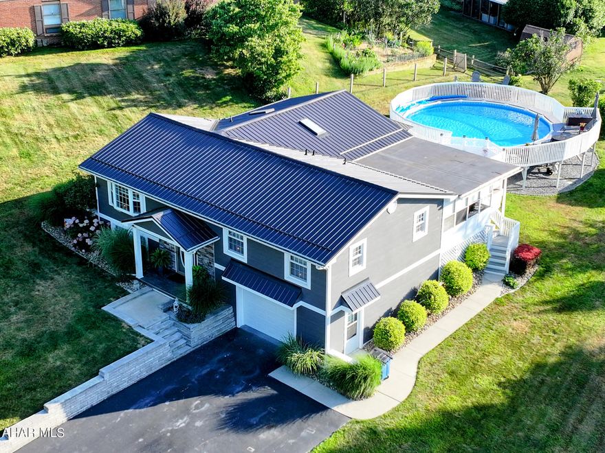 Move-in ready beauty in Meadowbrook Terrace awaits you! Just a short walk from the Historic town of Bedford you'll find this sweet split-level nestled in a peaceful neighborhood. Newly updated kitchen with shaker cabinets, quartz countertops and many convenient features. Stainless kitchen appliances included. Spacious open concept dining and entertaining area. Living room invites natural light and cozy get togethers with sky-lights and propane fireplace. Adjacent sun-room is the perfect place for your morning coffee or evening yoga session. Newly updated main bath with glass walk-in shower and soaking tub. Three main floor bedrooms. Basement is finished with walk-out access and houses the primary bedroom, spacious closets and 3/4 bath. Basement bedroom could be converted back to a family or rec-room with ease. One car attached garage. Enjoy entertaining on the back patio, gather around the fire-pit or have a drink by the pool! Don't miss out on this one, set up your private showing today!