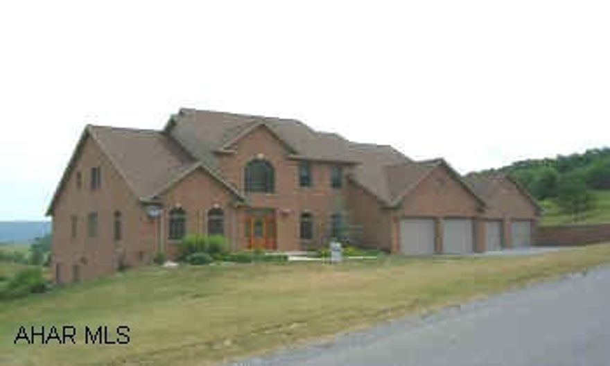 BRICK CONTEMPORARY WITH 1ST FLR MASTER SUITE WITH FIREPLACE.  GORGEOUS GREAT ROOM WITH HARDWOOD FLOORS.  14X35 DECK OVERLOOKING THE VALLEY.  CUSTOM BLINDS, 2 CAR ATTACHED AND 2 CAR DETACHED GARAGE, BACK-UP GAS STOVE IN BASEMENT, CORIAN COUNTERTOPS, 1ST FLR LAUNDRY, VINYL DECK.