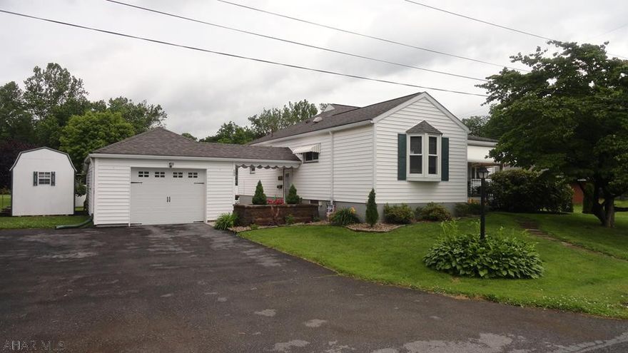 One story home with spacious kitchen, eat-in area, ceramic back splash, living room with addition for gas fireplace, marble mantel, master bedroom with walk-in closet, master bath, main bath, central air, finished basement with possible 3rd bedroom, detached covered garage, beautiful landscaped yard with privacy fence.