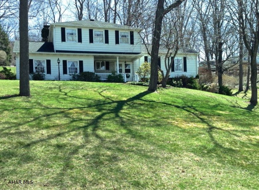 Beautiful home in prime Meadowbrook location with gorgeous of views of the town below.   A wonderful floor plan makes this home truly special. Granite counters and backsplash add elegance to the renovated kitchen that overlooks the large family room.   The rooms enjoy  a wall of windows that take in lovely views of the back terrace. Formal living and dining rooms, laundry room and 1/2 bath make up the first floor. Four bedrooms with plenty of closet space and two full baths make up the second floor. The lower level consists of a 23 x 21 recreation room, which is great for entertaining. Room sizes and square footage approximate. Price includes an extra building lot with sewer and water taps.