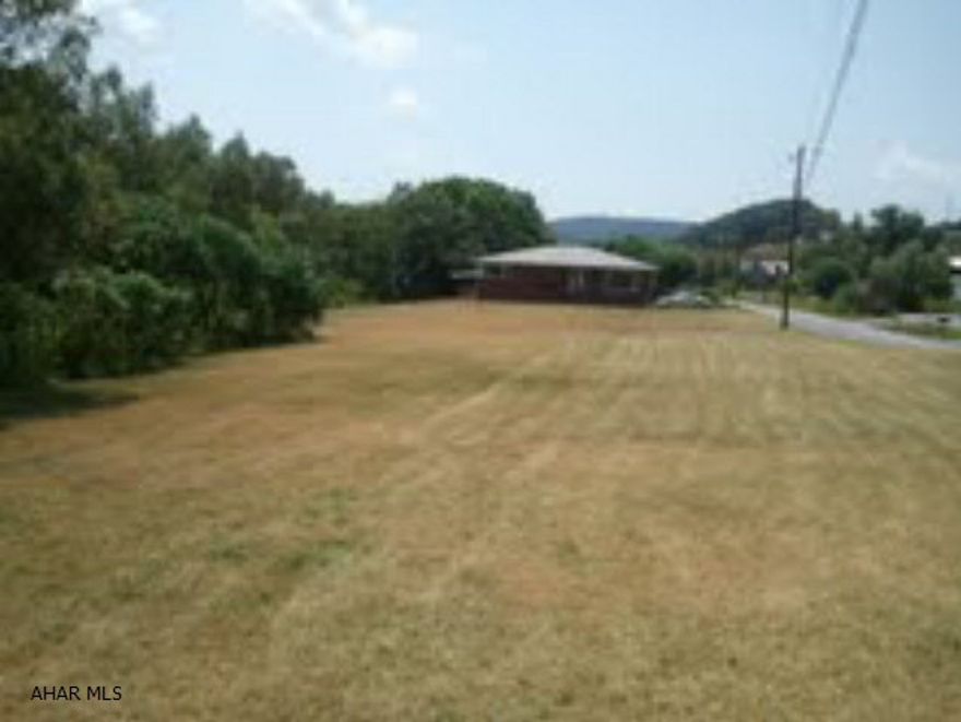 This solid brick rancher is on a huge lot (350 feet by 85 feet).  It has a covered front porch, a large and private covered back deck, a 2-car attached garage, and a stream running along the back of the property.  It needs a kitchen, a partial bathroom, some drywall and insulation, finishing trim work, and floor coverings.  Priced to sell.