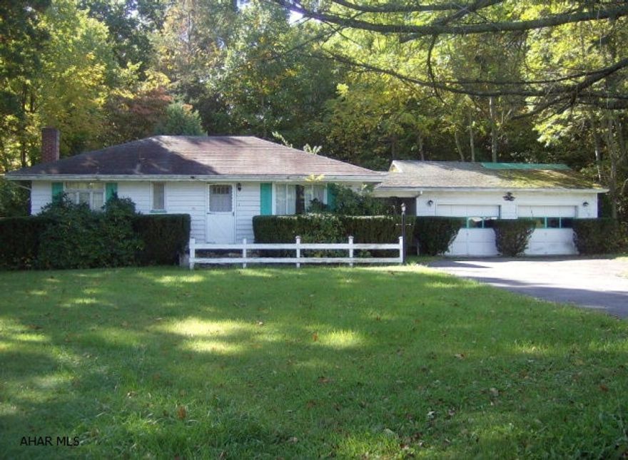 Property has a wood burner that is hooked up to the vent system.  The roof is in need of repair or replacement.  Beautiful setting.