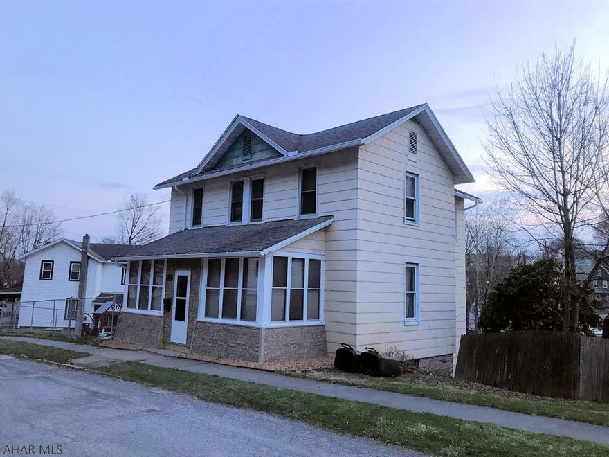 Enjoy the benefits of home ownership in this cute 2 Story on a corner lot! Upgraded and move-in ready with features you are sure to love! Picture you and your friends sitting around the firepit in your back yard or taking in the village view from your side porch. Your pets will soak up the sun in the fenced in yard area while you putter in your garden. When the sun goes down, you can relax in the comfy living room or curl up with a book in the 3-season enclosed front porch. You're sure to appreciate the first floor laundry, two new full baths and the beautiful hardwood floors. Parking won't be a problem with a garage, paved drive and off-street parking. The extra toys and lawn equipment can be stowed in the shed and you are good to go year round! A great place to call home!