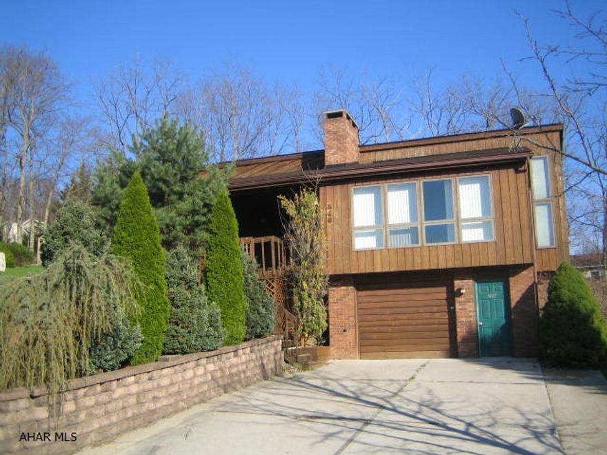 Rolling Hills Cedar Contemporary. Needs work, but could be a real gem. Living room w/ vaulted ceiling and brick FP, master suite w/ whirlpool tub and stand up shower, eat-in kitchen w/ breakfast island, finished basement w/ family room and nice wet bar. 1 car integral garage w/ opener, relaxing covered front porch and central air. Great location! Buyer pays both transfer taxes.