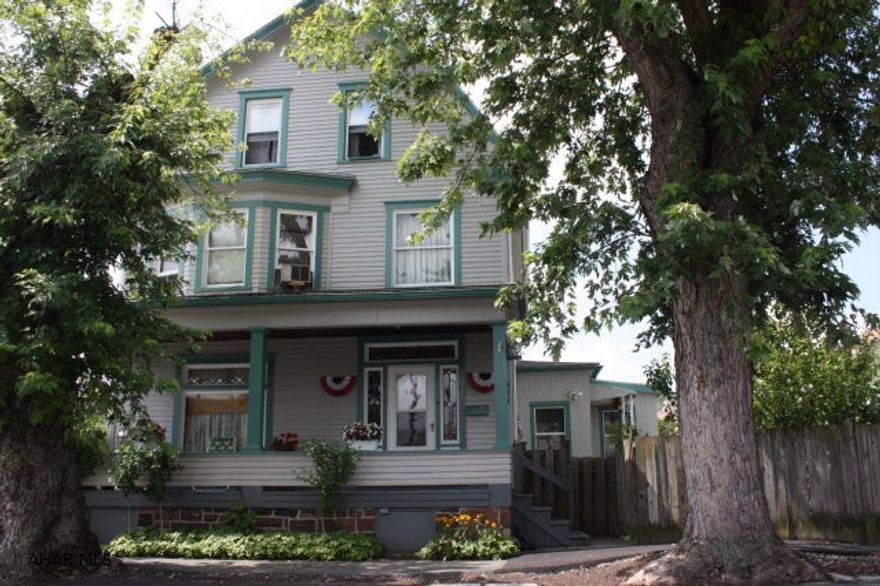 If you would like to live on a quiet corner in the city of Altoona, this is it. This charming house has been well maintained and updated. New roof was installed in 2002, new furnace 2008 with heat pump and central air.  Kitchen is large with eat in area and updated with Oak cabinets and Oak wood work. The wood trim in this house is outstanding.  Have your friends and family over and hang out on the lg covered front porch, deck and patio.  Read the morning paper and sip you coffee in the sun room located directly off the kitchen.  There is a small shed for tools and extra's and a 1 car garage.  This home is so cozy it will wrap it's arms around you when you walk through and view it. Set up a showing today!!!