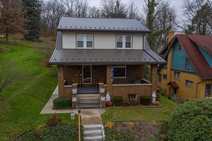 Incredibly well built brick home in a quiet neighborhood tucked away but close to everything. This spacious home offers a large oversized eat in kitchen with a bonus room including a cozy fireplace. Entertaining areas behind and the home is backed up to woods where wildlife can often be spotted. Central air and hot water heat make this a comfortable year round home. Large covered porch for relaxing and even a gas plumbed hookup for grill out back make this a home to sit back and enjoy. Three bedrooms and 1.5 baths with a two sided entry staircase to the 2nd floor. Brand new metal roof last year.