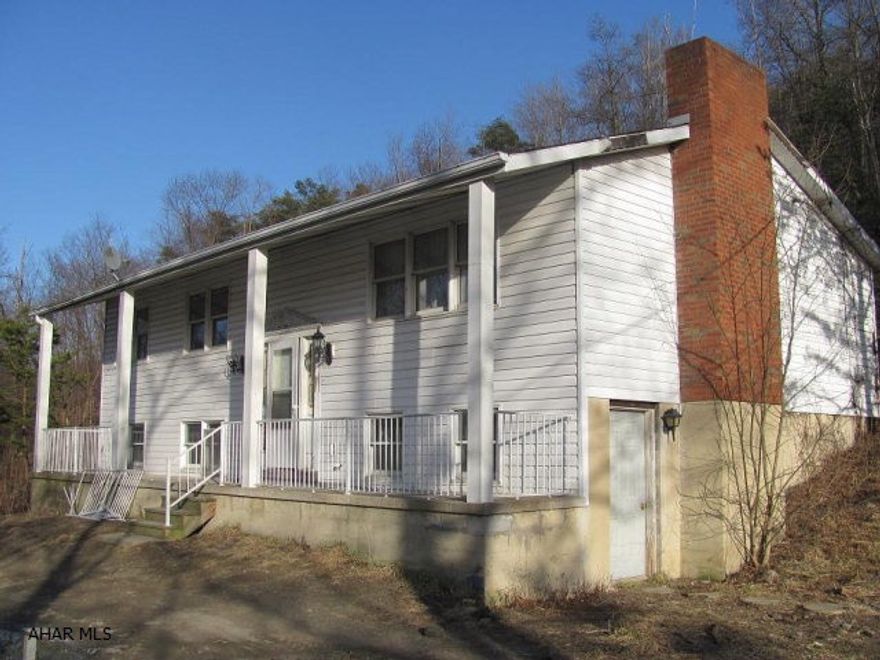 Hollidaysburg schools, Frankstown Twp. 3BR, 1 1/2 bath vinyl sided split entry home on approx 9.4 acres. Full unfinshed basement w/ walkout, wood fireplace in LR. Oil HW heat. property is being sold as-is