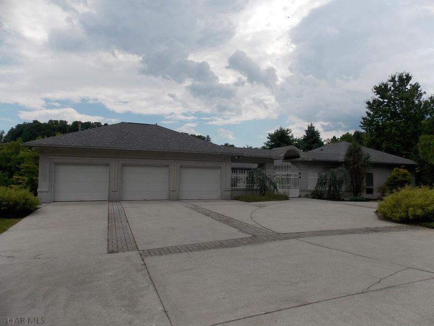 This one of a kind property has so much to offer! Beautiful eat-in kitchen features tile floors, stainless steel appliances, and a center island. Lovely open floor plan from kitchen to dinning room. Splendid sitting room adjacent to kitchen. Gorgeous living room that has a tray ceiling and tile floors. Spectacular master bedroom that is large enough for plenty of furniture and has a master bathroom. All 3 bedrooms have walk-in closets. Recreation room above the garage is great for entertaining. Large heated 3 car garage gives ample storage. You will love the beauty of the magnificent courtyard and outside nook! This is a wonderful opportunity to own a peaceful and private home on 4.7 Acres! Sellers are currently in the process of appealing the property taxes.