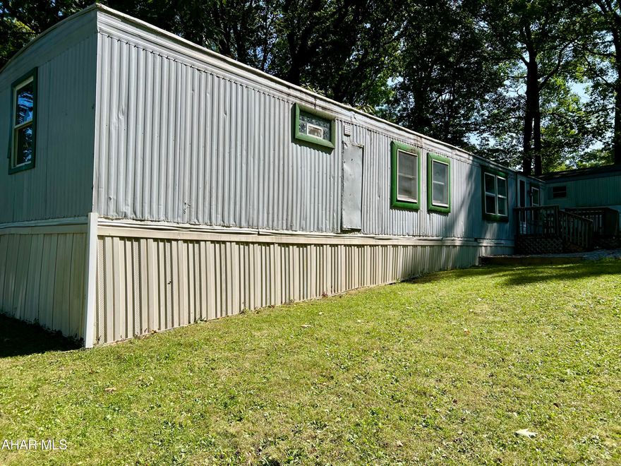 Singlewide manufactured home. 2 bedrooms, 1 full bath. Updates included some new windows new vinyl plank flooring, Updated Kitchen and drywall though out. Lot rent is $390.00 and includes W/S and trash. . Buyer will need to apply at Hill Crest Mobile Home Village.