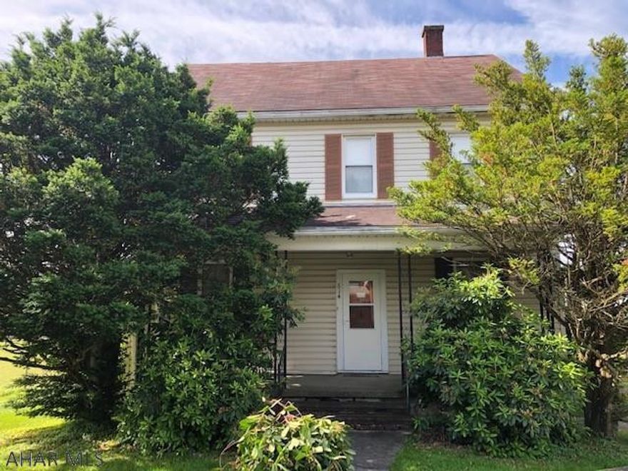 Large two story ,  this home is in need of updating  throughout. Featuring a very large living and dining room. Kitchen needs to be re configured and replaced.  Great location, large detached two car garage.