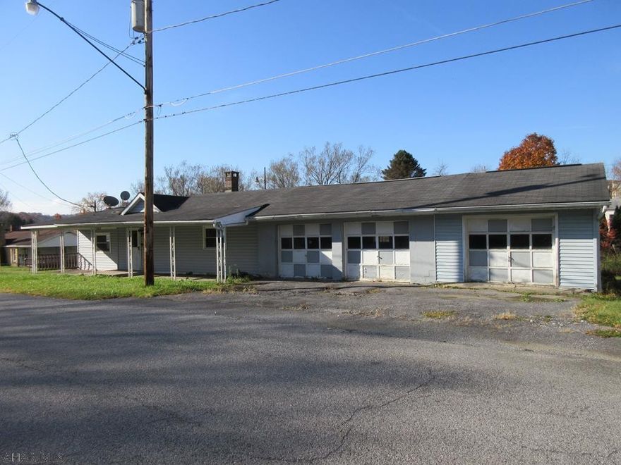 1 story Nanty Glo property on 0.59 acre lot with 3 car attached garage. Property needs work, but good layout and loads of possibilties. AS-IS sale. Seller will make no repairs. Buyer responsible for required municipal sewer test and any repair escrow.
