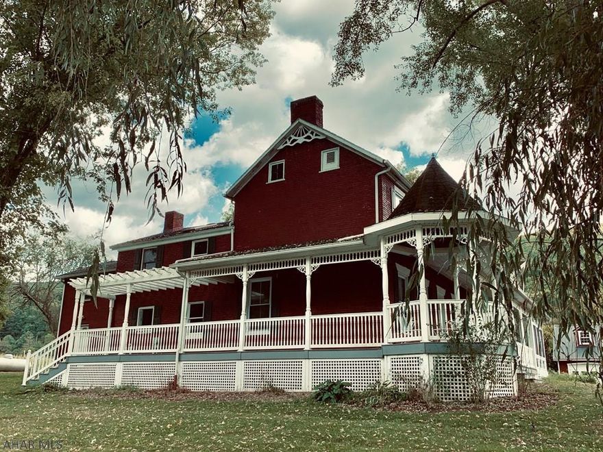 Magical merging of french inspiration and peaceful tranquility have created an oasis in Bedford County on 120 acres that must be seen to be appreciated.  No detail has been overlooked in this home's stunning creation.  From the gorgeous wraparound porch with towering weeping willows to the Monet inspired ponds this serene setting will impress even the most discriminating buyer.  Picture worthy barn and a mile of river front make vacationing a thing of the past.  Click on the virtual tour to see what you are missing.