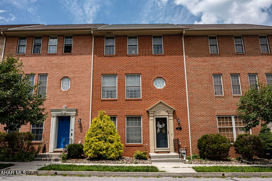 215 Sweet Cherry Court is a well-maintained stately 3 story brick townhouse built in 2000 located in Hollidaysburg, PA.  in the desirable Holliday Hills neighborhood.  It has 2 bedrooms, 2.5 bathrooms, and a large 2 car detached garage with room above for storage.  The open concept kitchen has a beautiful view of the patio.  Lower entrance floor could serve as a 2nd family room or guest suite with a full bath. Spacious defines this property.  Property is handicap friendly with a new 2 story Stairlift that comes with the property.  Each of the upper floors have laundry chutes to first floor.  Outdoor roofed patio area is perfect for entertaining and requires almost no maintenance.  Holliday Hills townhouses also offer a playground and picnic area.
