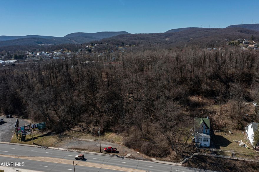 Two adjoining vacant lots offering endless potential in a high-traffic area—ideal for your next investment or development project. One lot is zoned commercial, and the other residential, providing flexibility for a variety of uses. Both lots are partially cleared and situated on a gentle slope, making them ready for your vision.

Whether you're considering a retail store, office space, mixed-use development, or a live/work setup, this location offers high visibility and excellent accessibility. With strong traffic flow and versatile zoning, this property presents a fantastic opportunity for a business venture or future growth.

Don't miss your chance to bring your ideas to life in a prime location with plenty of possibilities.