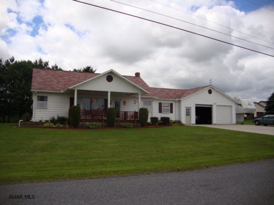 Fabulous 3 BR/2 BA Ranch on 2 acres. Many updates throughout. Offers concrete driveway, 28x28 2 car garage with 28x11 pad for Camper. Relax on the 12x20 front covered deck while taking in the beautiful views. Gorgeous large kitchen with cathedral white washed ceilings, lots of cabinet and counter space, and eat-in-area. All kitchen appliances are included. Full bath with laundry hook-ups off kitchen. Partially finished basement great for entertaining with bar, beautiful custom built-in entertainment center, pellet stove, ceramic tile and commercial grade carpeting throughout. Newer furnace, hot water heater and oil tank. Walk up attic could be finished for extra living space.