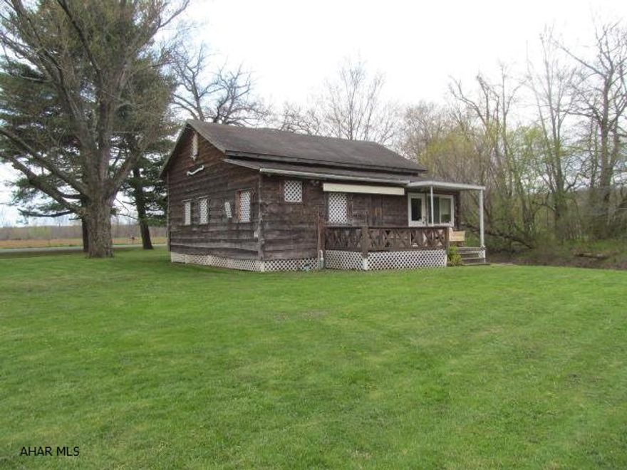 Everything STAYS! Fully furnished waterfront property was designed w/FUN in mind. Pool table, ping pong, darts, chess set, kayaks,- all come w/ the property3 bdrm, 1 bath, lg living rm, enclosed sun porch. Hemlock siding. Unique design inside & out on 3/4 of an acre.