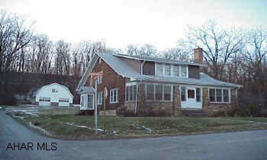 Great 4 bedroom brick & stone home on .688 acre lot.  Large garage with a workshop and loft.  Located right below the Park Hills Country Club in Logan TWP.