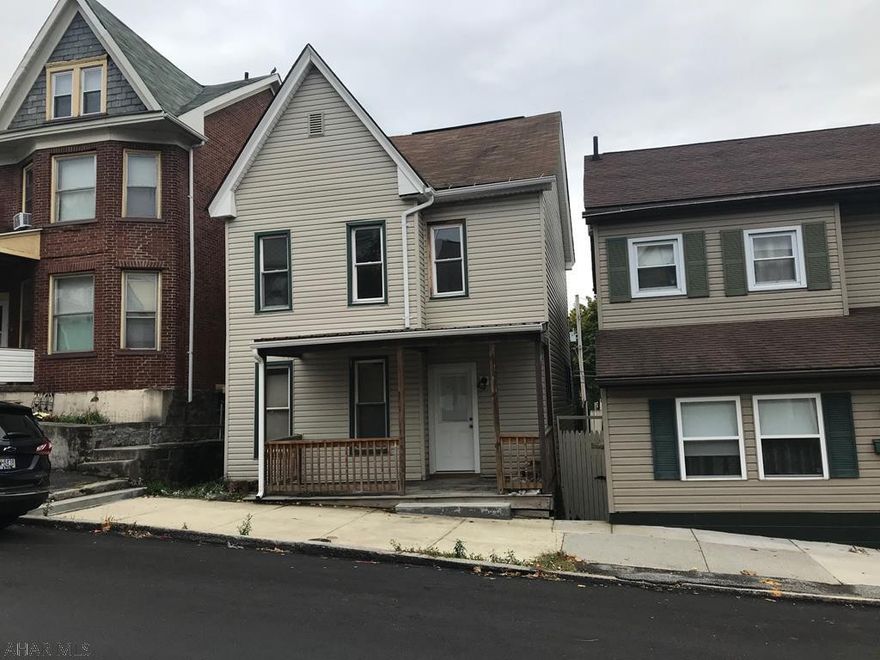 The exterior of the home is vinyl siding, shingle and metal roofs. The interior is gutted by the owner in preparation for drywall and total remodedling. The wiring has been updated and partially completed. Windows are older, replacement. Basement has ceiling height 5'8" clearance. Old furnace is not hooked up. Wiring has 100 amp circuit breaker panel. Electricity is off, take flashlight.