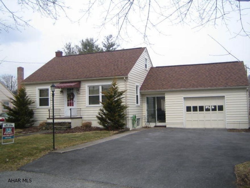 Picture perfect Cape Cod home with one floor living in Duncansville Borough.  Features level double lot, large covered patio, fenced rear yard, over-sized 1 car attached garage w/ breezeway, automatic opener & pull down stairs to storage.  All recently updated with thermo windows, high-efficiency furnace, central A/C unit, newer roof and electric service.  One floor living with 2 first floor bedrooms and full bath.  Second floor features large 3rd bedroom.  Half bath in basement.  Home is NOT in a flood zone.  Walking distance to park and ball field. Hardwood floors under carpeting. Seller is related to agent.