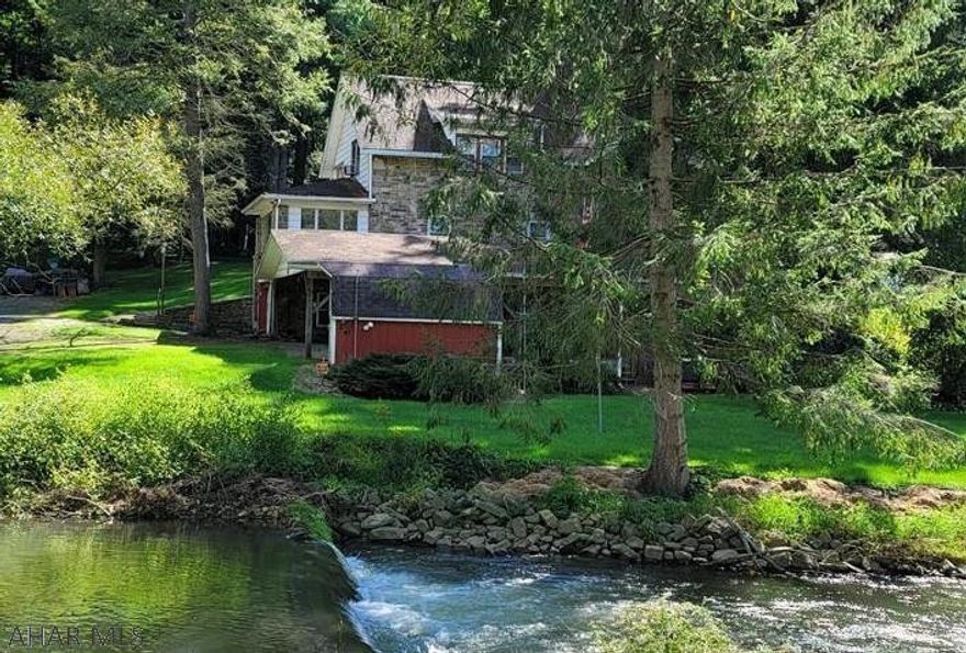 Highly sought after Spruce Creek with approximately 266ft of frontage on Spruce Creek!  Enjoy stream-side nature at its very best with your own little piece of Class A trout fishing. A stone 3 bedroom home sits a top a small hill that overlooks the creek and large 1 acre of yard. From each room of the house, open windows to the peaceful sound of the water. Each bedroom offers closet space and there is a second floor balcony to watch the deer and other wildlife play.  This could be the most perfect opportunity for an outdoor enthusiast to host and its only a 40 minute, beautiful drive from the State College Airport, PSU campus and all that has to offer.