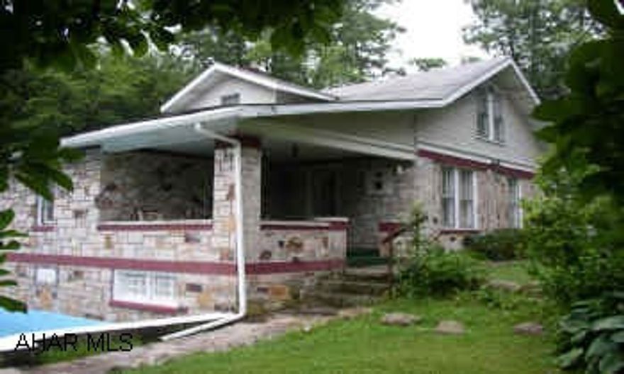 CHARMING STONE HOME WITH A BEAUTIFUL SETTING. MANY UPDATES. METICULOUSLY MAINTAINED.