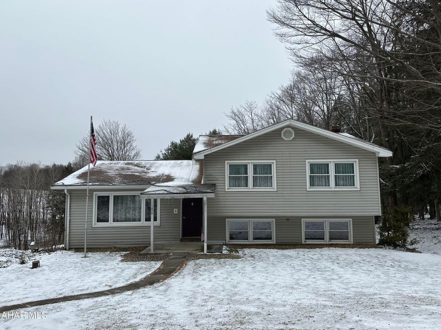 Multi-level home on a beautiful, partially wooded, 2.54 acre lot with Diamond Run passing through the lower part of the lot, 3 bedrooms, 2.5 baths, finished basement with wood burner that walks out at ground level, attached two car garage, lots of paved parking area, shed, newer heat pump with central air