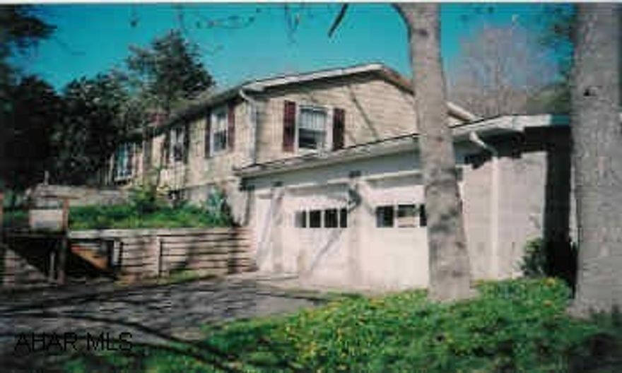 Workshop in Basement and a wood stove for supplemental heat.  Property is wooded offering great hunting opportunities and just a few miles from State forest areas.