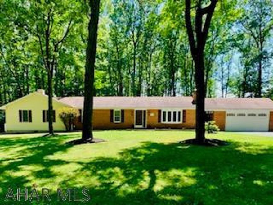 Beautiful tucked away ranch home w/mature trees for privacy on 0.574 acre. New flooring, fixtures, 3 new ceiling fans, nicely painted, laundry on the MF next to the master suite for convenience. The LR has a Bay window w/new flooring. DR w/built-in oak hutch, glass pocket doors to kitchen and LR w/bay window adds a nice touch. The kitchen cabinets are solid oak, new counter depth refrigerator,ceramic tile Fl. and sky light for natural lighting. The master suite offers a 22' walk-in closet, gas fireplace, living area, french doors w/pet friendly walkout to deck, master bath w/jet tub, fireplace, ceramic tile separate shower. The recreation rm w/bar, entertainment area,1/2 bath, new vinyl FL, bedroom/storage, extra laundry hook up. Exercise/game rm., storage behind garage. 14x20 shed