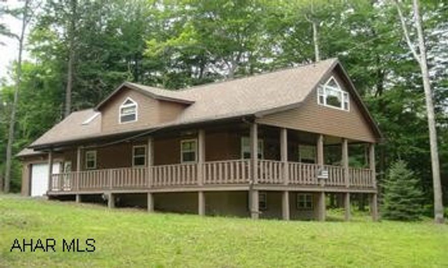 BEAUTIFUL MOUNTAIN HOME. 1.5 STORY, 2-3 BR'S, OPEN FLOOR PLAN, GREAT ROOM WITH SECOND FLOOR LOFT AREAS. LARGE COVERED FRONT & SIDE PORCHES. IDEAL RESIDENCE, 2ND HOME, OR RETIREMENT GETAWAY. MUST SEE RETREAT! RETREAT IN MOUNTAIN GATED COMMUNITY. IDEAL RESIDENCE, 2ND HOME OR RETIREMENT GETAWAY. 1.5 STORY, 2-3 BEDROOM, 1.75 BATHS, OPEN FLOOR PLAN. LARGE COVERED FRONT & SIDE PORCH. FIRST FLOOR BEDROOM. GREAT ROOM WITH FREE STANDING PROPANE STOVE/FIREPALCE. LOFT AREA INCLUDES; DEN/OFFICE, BEDROOM, 3/4 BATH AND SETTING ROOM THAT COULD BE POSSIBLE 3RD BEDROOM. FULL BASEMENT W/WALKOUT & WINDOWS, POSSIBLE FAMILY ROOM/BEDROOM/OFFICE. INTEGRAL GARAGE. NEAR STATE GAME LANDS, STATE PARK, FISHING, BOATING & ROCK RUN ATV TRAILS. FOR MOUNTAIN LIVING AT ITS BEST, CONTACT GAIL CORLE 932-3231.