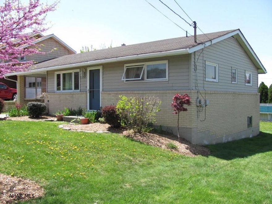 Portage -2 BR brick & frame ranch home with gas hot water baseboard heat, hardwood floors. Gas fireplace in FR. Carport. Move-in condition