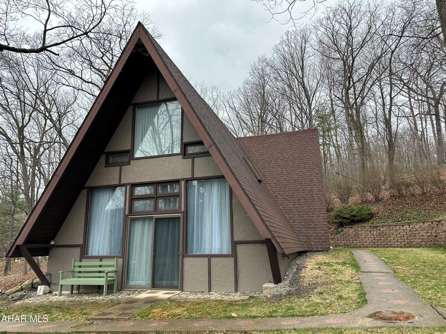 Unique A-framed home on wooded lot.  Great location, close to everything. This home has an open floor plan for your living enjoyment. 24 hour notice for showings.