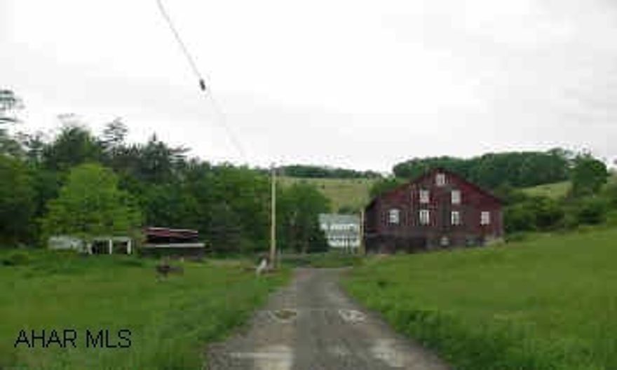 Great Secluded Property with much potential!  Old Farm House, Olld Barn, Machine Shed, 2 Car Garage -- situated in a very secluded setting on appoximately 191 Acres of land -- Some tillable and some pasture and some wooded.  Some good timber. Must See! Great Secluded Property with Much Potential!  NIce Stream running beside house!