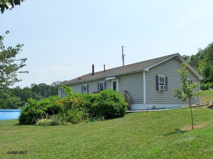 Very nice 3 BR - 1.5 BA ranch home and detached 14x24 garage on a one acre partially fenced lot with a wonderful view. Located just 3/4 mile above Yellow Creek trout stream on a shared private lane. INCLUDES HOME WARRANTY!!