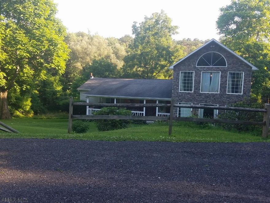 This property is a must see if you're looking for privacy. Here's your opportunity to own this home with 32.04 acres. This property boasts 11 fruit trees, 2 creeks, a spring, 4 acres of mow able yard, 28 wooded acres of hunting ground. 3 bedrooms, 3 full baths, large kitchen, and a full balcony overlooking the large spacious living room, and a bonus room.  The existing ranch style home was renovated in 2000 and the 2 story was new construction in 2000. 2-bay steel building. Very close to the state game lands, and close proximity to shopping and restaurants. 30 minutes from Lake Raystown.