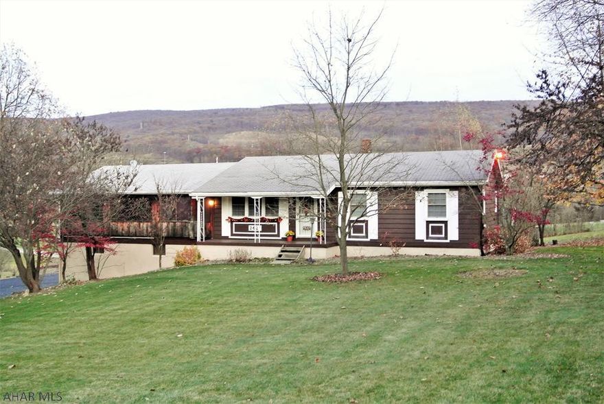 Check out this sweet One-story home setting on 1.08 Acres.  Wow!  That is a unique find in town where you are just merely minutes from everything! . This exceptionally nice home offers an eat-in Kitchen with Charming custom oak cabinetry, Stainless steel appliances, spacious rooms, with one floor living!   It also offers, a very large and spectacular family room in the lower lever surrounding in charming rough-cut lumber to give it that semi-country feel.   This home has another unique feature, it has a massive closed-in porch over the garage used for entertaining or just sitting catching the cool breeze after dinner in the summer.  The centered setting of this home gives it a peaceful quiet feel, and while using the pool or deck you have no rear neighbors allowing the privacy you deserve.