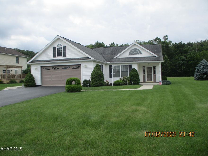 Exceptionally attractive and convenient ranch built by Zane Helsel in 2006.  Gracious entry with storage opens to attractive living room, formal dining room and spacious kitchen. Oak cabinetry and woodwork throughout.  Kitchen appliances included, new dishwasher in 2023.  Bar for casual dining.   Owner's bedroom features two large closets and ensuite bath appointed with easy to use step-in shower.  Two additional bedrooms and main bath.   Large two car garage features a spacious overhead storage area with access to the upper windows for seasonal lighting, cleaning, etc.  Central vacuum system with a special crumb catcher in the kitchen.  Laundry located off the kitchen with additional storage.  Covered porch  overlooking wooded area.  OFFERS WILL BE ACCEPTED UNTIL 1 p.m. ON JULY 10 AND REVIEWED BY SELLERS AT 3 P.M.