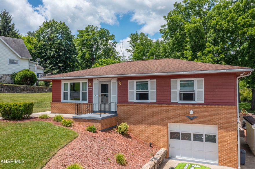 This move-in ready raised ranch home sits on a spacious, meticulously maintained lot. It boasts 3 bedrooms and 1.5 bathrooms, with newly installed vinyl plank flooring throughout the main level. The bedrooms are generously sized, including a primary bedroom with an attached half bath. The kitchen offers ample cooking space and an eat-in area perfect for a table and chairs. Adjacent to the kitchen, a formal dining room opens into the living room. A highlight is the four seasons room off the dining area, seamlessly integrating indoor and outdoor spaces. Downstairs, discover additional storage, a workshop area, and versatile living space with endless possibilities. Access to the one-car garage is conveniently located through the basement.