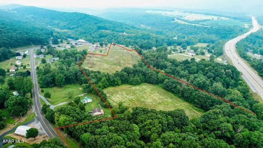 Welcome to this 21.74 +/- acre parcel of land on Winding Ridge Road in beautiful Everett! This stunning piece of property features a wide variety of natural features, including a mix of open field and wooded areas, as well as some valuable timber. There is even  rental income from the property's two billboards. Plus, with public sewer available, you won't have to worry about septic issues!

Whether you're looking to build your dream home or simply invest in a piece of prime real estate, the possibilities are endless with this amazing property. So why wait?  See for yourself all that this magnificent land has to offer!