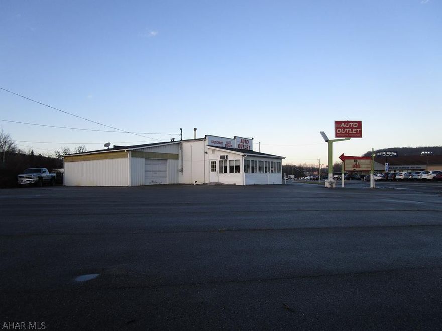 Corner lot on busy 764 and Burns Avenue. Formerly used as auto sales lot, office and garage. Paved lot with great visibility. Office and garage in one building and could be converted to other uses. Great location and an acre lot. Garage has 2 lifts, compressor and some equipment.