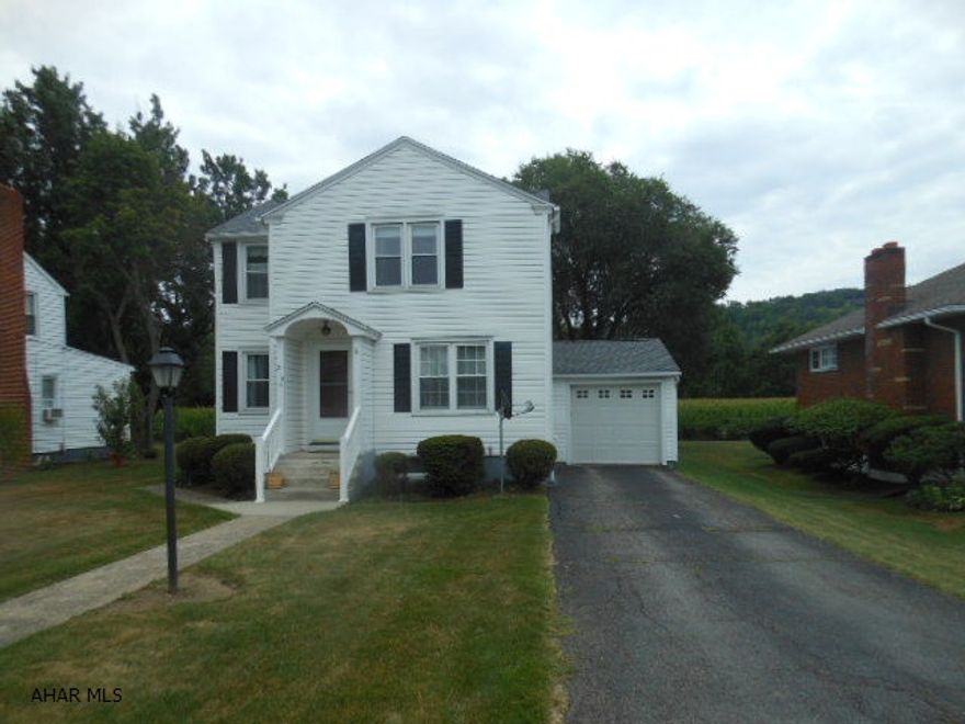 Nice as can be is this charming 3 bedroom home with new roof,(2013)updated heating, A/C and electric. Corner cupboard in dining room-nice and bright kitchen. Terrific large relaxing back covered deck and total fenced yard, plus a 1 car attached garage. New quote for flood insurance is $567.04