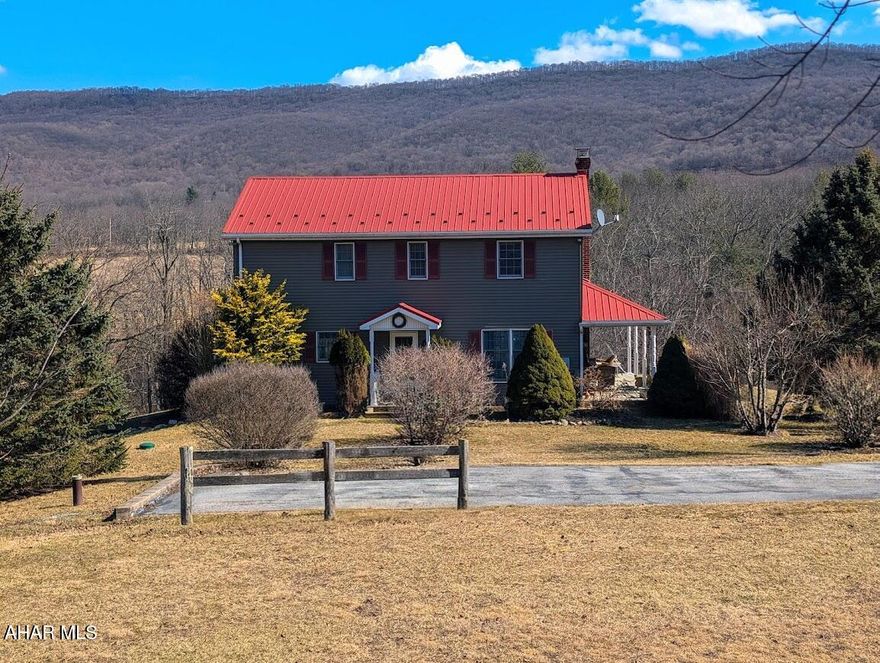There is so much to enjoy in this country home situated on 12.7 acres with easy access, yet nestled among the mountains. This one checks all the boxes for enjoying life off the beaten path with lots of unique touches from the past such as old fashioned wood doors and a cozy clawfoot tub on the second. The primary bedroom has an ensuite full bath and walk-in closet. Sip your morning coffee in the open concept kitchen or while relaxing in the spacious living room in front of your fireplace. Read a book on the front wraparound porch or take a stroll out back in the open field. The walkout basement has a gorgeous propane woodstove and ample space for a rec room or additional living space along with a large storage area and utility room with loads of shelving and an oversized freezer. The large detached pole building/garage/barn combination is perfect for storing your vehicles and equipment or maybe farm animals. Located minutes from White Sulfur Springs Retreat and Shawnee State Park. This truly is a home you won't want to miss. Call for your tour.