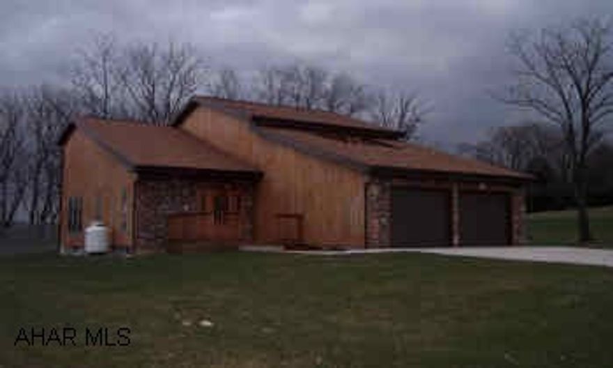 cedar sided contemporary Beautiful well built home with lots of charm. Living Room has cathedral cailings and hardwood floors, oak kitchen, master bedroom features a gas fireplace, a finished basement with gas fireplace