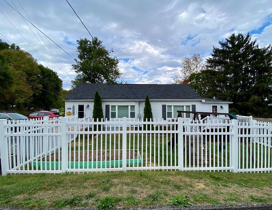 Looking for a starter home or considering downsizing? Look no further! Cozy ranch home on Cold Springs Road, convenient location and a short walk to Standing Stone Elementary, complete with white picket fence. This home boasts an open concept layout with one floor living. The kitchen features granite counter tops and oak cabinets. This home offers both oil and efficient wood heat. The wood burning furnace heats entire home with forced air. Enjoy the fenced yard, swing set included, with ample parking for guests and a partial concrete block garage.
